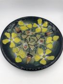 A Moorcroft 26cm plate, clematis design.