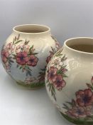 A Pair of Moorcroft Spring Blossom vases 17cm tall.