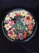 A Moorcroft Charger with a floral design 35.5cm