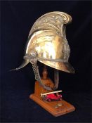 A Vintage Brass Fireman's helmet on later display stand, inscribed S.Smith 1926-40