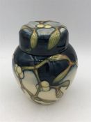 A Moorcroft Ginger Jar, blue cream with mistletoe 11cm