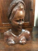 A carved wooden statue of a women