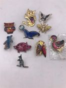 Ten enamel/cloisonné animal brooches to include owls and a bug