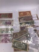 A Collection of military and government issue bank notes from around the world.