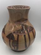 A 24cm tall Moorcroft vase in brown, mushroom pattern