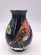 A Moorcroft small robin and holly vase 13cm tall M/2231