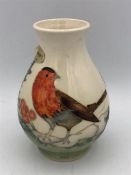 A Moorcroft vase with a Robin theme.13cm tall.