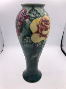 A Moorcroft rose vase 14/500 26cm tall.