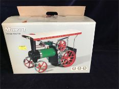 A boxed Mamod Steam tractor.