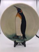 A Moorcroft Penguin themed plate 26cm 12/150