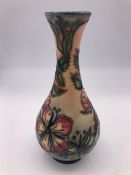 A Moorcroft Bud Vase 17cm tall.