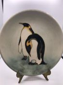 A Moorcroft Penguin plate 11/150 26cm diameter.