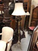 A Tall Brass and Onyx Standard Lamp on Tripod Legs.