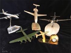Five model planes from metal on plinths