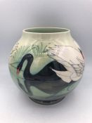 A Moorcroft Swan themed vase 16cm tall.