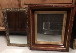 Two small mirrors one wood with gilt edge and another ornate brass.