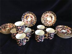 Royal Crown Derby to include seven coffee cans with saucers.