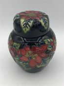 A small black Moorcroft floral ginger jar 11cm