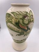 A Moorcroft Chinese Dragon themed vase 25cm tall.M/1904