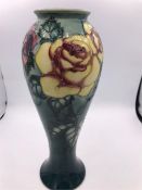 A Moorcroft Rose vase 16/500 26 cm tall.