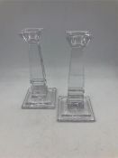 A pair of cut glass candlesticks