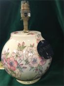 A Moorcroft lamp base, sprig blossom pattern 17cm.