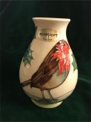 A Moorcroft Robin themed vase.