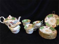 A part Coalport Tea set to include four tea cups, seven saucers, milk jug, sugar bowl and tea pot,