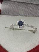 An 18ct white gold sapphire and diamond ring