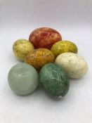 A selection of decorative marble/onyx eggs etc.