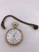 A gold Waltham pocket watch