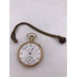 A gold Waltham pocket watch