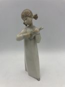 A Lladro figure of a little girl