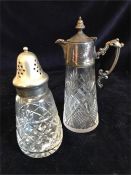 A hallmarked silver claret style jug and a silver topped sugar shaker.