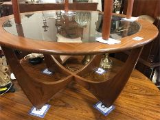 A Mid Century circular glass topped coffee table