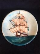 A Moorcroft charger depicting a ship 35.5cm.