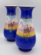 A Pair of vases by Ryde with Arabian theme 25cm