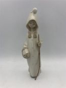 A Lladro figure of a Shepherdess with a basket