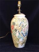 A 33cm Moorcroft pattern lamp base with blue and red flowers