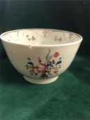 A hand painted tea bowl has firing crack.