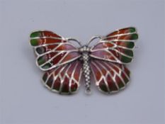 A Silver and Plique A Jour Butterfly brooch