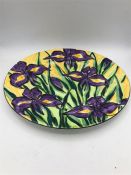 A hand painted Iris plate by Annie Doherty 28cm.