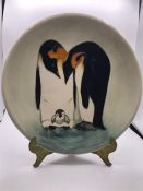 A Moorcroft Penguin plate 20/150 26cm diameter.