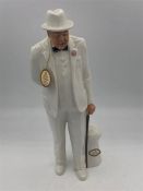 A Royal Doulton figure of Winston Churchill in a white suit