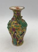 An Oriental small vase 11cm tall.