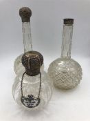 Three cut glass silver scent bottles