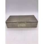 A hallmarked silver cigarette box Birmingham 1945 makers mark J R