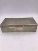 A hallmarked silver cigarette box Birmingham 1945 makers mark J R