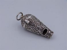 A silver vinaigrette and whistle with gilded interior and embossed case.