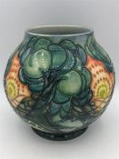 A Moorcroft vase green grounds with orange flowers 17cm